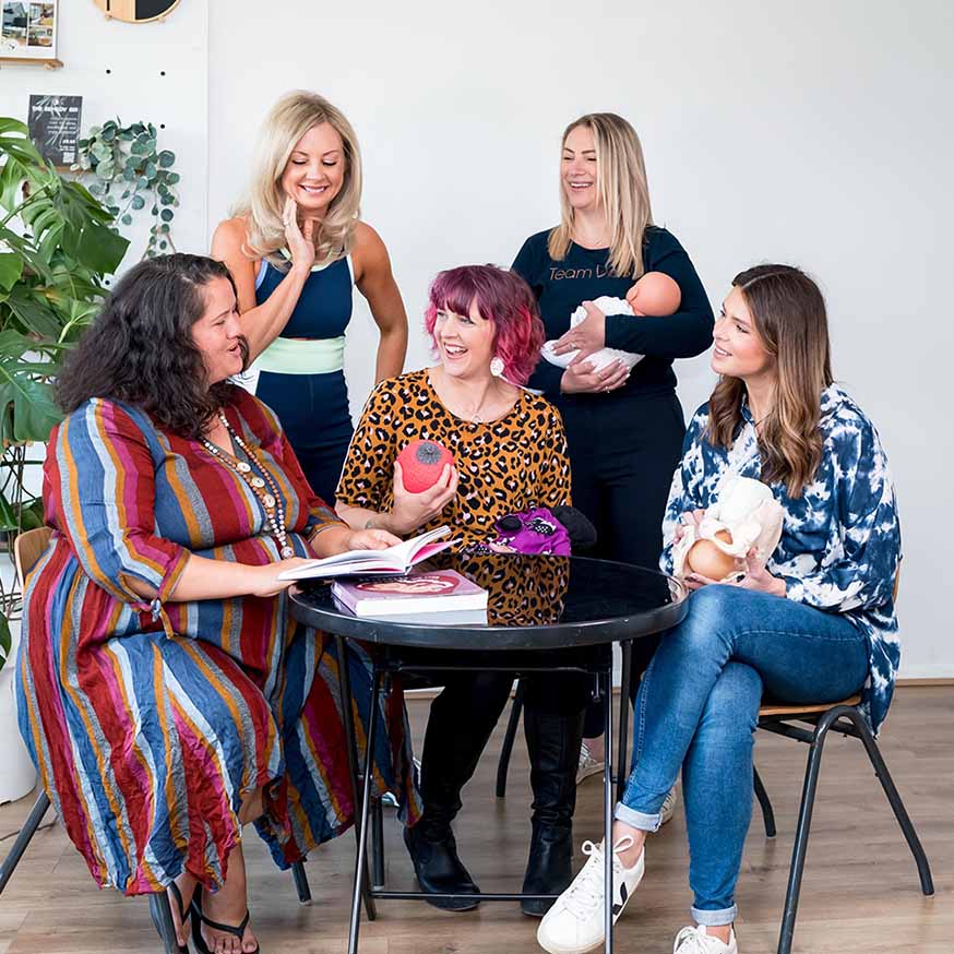 Happy mothers conversating round table